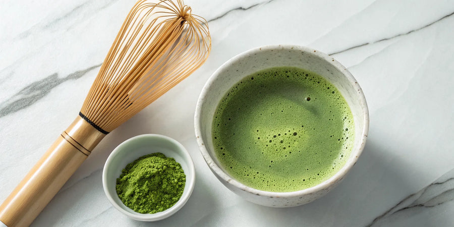 A cup of matcha tea with a bamboo whisk, a drink with potential side effects.