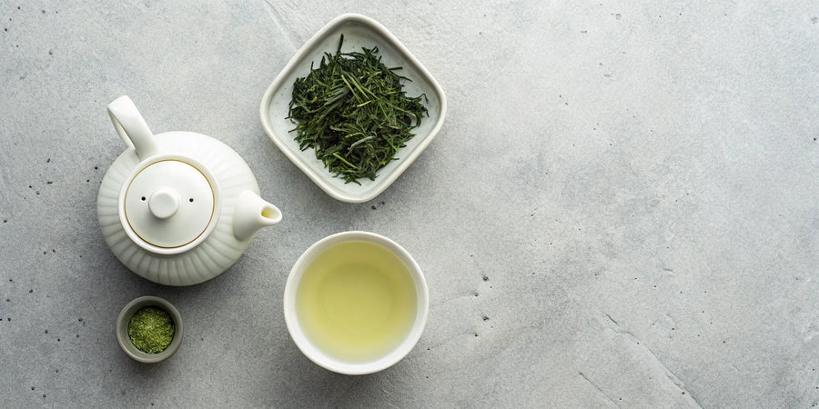 Premium gyokuro tea leaves with a traditional teapot and a freshly brewed cup.